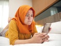 Muslim Woman Angry While Reading Text Message on Smart Phone Royalty Free Stock Photo