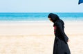 Muslim woman on the beach back view Royalty Free Stock Photo