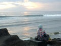 Muslim woman on beach at sunset Royalty Free Stock Photo