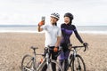 muslim woman cyclist taking selfie photo together at the beach Royalty Free Stock Photo