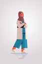 muslim woman doctor in uniform arabic female medical professional standing pose medicine healthcare Royalty Free Stock Photo