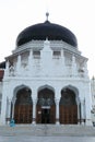 Muslim woman in front of Baiturrahman Grand Mosque in Banda Aceh Royalty Free Stock Photo