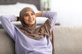 Muslim woman having rest at home on the weekend Royalty Free Stock Photo