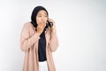 muslim woman in hijab whispering while calling on phone Royalty Free Stock Photo