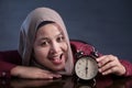 Muslim Woman Holding a Clock Royalty Free Stock Photo