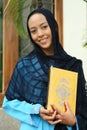 Muslim Woman Holding Qur'an