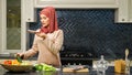 Muslim woman hosts culinary blog telling subscribers recipe