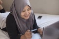 Muslim Woman Making Online Purchase Royalty Free Stock Photo