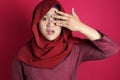 Muslim Woman Peeking Through Her Fingers Royalty Free Stock Photo