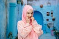 Tourist on a blue street in Chefchaouen, Morocco Royalty Free Stock Photo