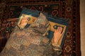 Muslim woman praying for Allah muslim god at room near window. Hands of muslim woman on the carpet praying in traditional wearing Royalty Free Stock Photo