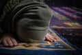 Muslim woman praying for Allah muslim god at room near window. Hands of muslim woman on the carpet praying in traditional wearing Royalty Free Stock Photo