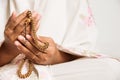 Muslim woman praying close up image of hands as she holds prayer beads,tasbih Royalty Free Stock Photo