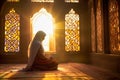 A Muslim woman prays in a mosque.