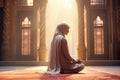 A Muslim woman prays in a mosque.