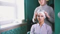 Muslim woman puts a tiara on the beautiful muslim bride`s head