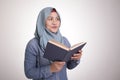 Muslim Woman Reading Book and Thinking Royalty Free Stock Photo