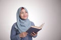 Muslim Woman Reading Book and Thinking Royalty Free Stock Photo