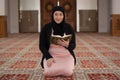 Muslim woman reading Koran Royalty Free Stock Photo