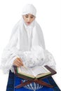 Muslim woman reads Kuran 1 Royalty Free Stock Photo