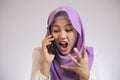 Muslim Woman Screaming Angry Expression, Receiving Bad News on The Phone Royalty Free Stock Photo