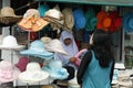 Muslim woman selling hats