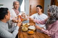 muslim woman serving drink for friend and family after fasting Royalty Free Stock Photo