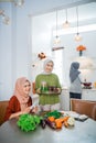 muslim woman serving drink for friend and family after fasting Royalty Free Stock Photo