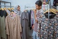 muslim woman shopping some dress for idul fitri with her husband Royalty Free Stock Photo