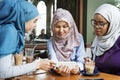 Muslim woman sitting in a cafe together Royalty Free Stock Photo