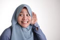 Muslim Woman Smiling While Doing Hearing Gesture Royalty Free Stock Photo