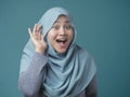Muslim Woman Smiling While Doing Hearing Gesture Royalty Free Stock Photo