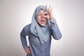 Muslim Woman Smiling, Looking Through Her Fingers, OK Sign Gesture Royalty Free Stock Photo