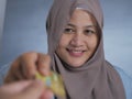 Muslim Woman Smiling When Receiving Credit Card Royalty Free Stock Photo