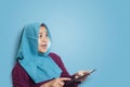 Muslim Woman Surprised to See Something Above when using Phone Royalty Free Stock Photo