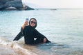 Muslim woman taking selfie on the beach Royalty Free Stock Photo