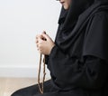 Muslim women using misbaha to keep track of counting in tasbih Royalty Free Stock Photo