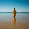 A Muslim woman in a veil or veil walks along the beach near the ocean. Royalty Free Stock Photo