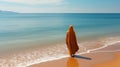 A Muslim woman in a veil or veil walks along the beach near the ocean. Royalty Free Stock Photo