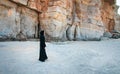 Muslim woman walking on the beach Royalty Free Stock Photo