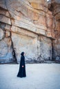 Muslim woman walking on the beach Royalty Free Stock Photo