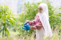 Beautiful muslim girl Bright smiles, relaxing days in the garden