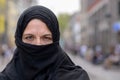 Muslim woman wearing a black hijab in town Royalty Free Stock Photo