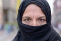 Muslim woman wearing a black hijab in town Royalty Free Stock Photo