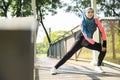 Muslim woman working out alone