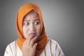 Muslim Woman Worried, Nervous and Looking to the Side