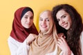 Muslim women in fashionable dress isolated on yellow Royalty Free Stock Photo