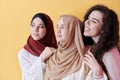 Muslim women in fashionable dress isolated on yellow Royalty Free Stock Photo