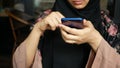 muslim women hand holding smart phone