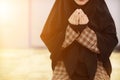 muslim women in hijab are praying to show respect and thanks to allah according to muslim belief and muslim women in hijab are